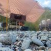 Camping image with awning and truck