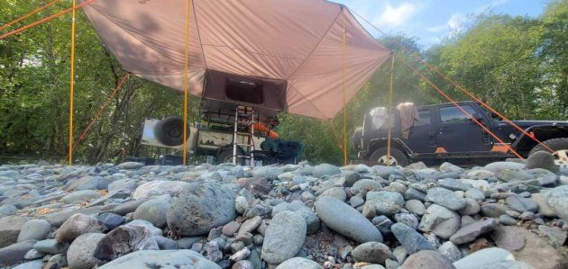 Camping image with awning and truck
