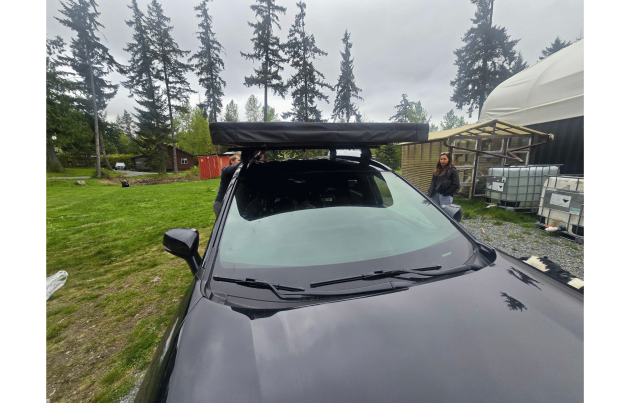 Trail Lite roof tent mounted on a vehicle, offering compact and durable camping solution for overland adventures