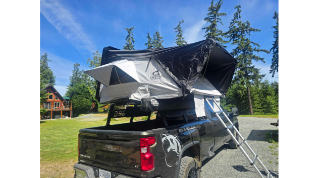 Outland XL™ ABS hard shell rooftop tent mounted on an SUV, featuring a spacious elevated sleeping platform with a durable weatherproof shell, telescopic ladder, and four-season camping design for families and overlanding adventures.