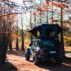 Vertical pop up hard shell rooftop tent