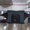 SkyRise aluminum vertical pop-up hard shell rooftop tent deployed on overland truck