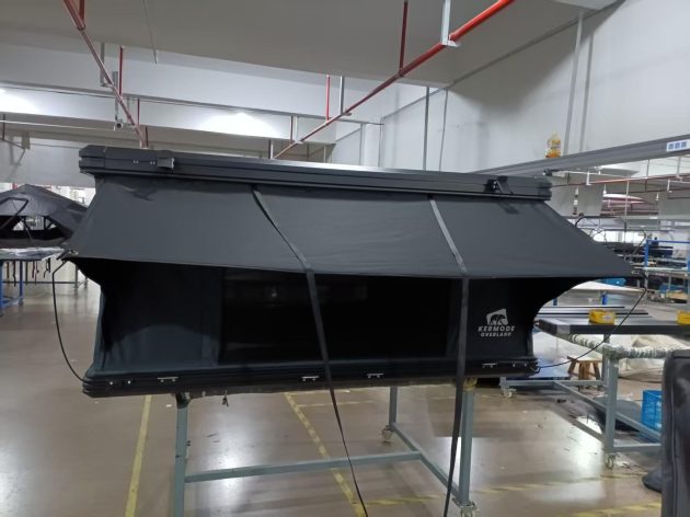 SkyRise hard shell rooftop tent closed with low-profile aluminum shell on SUV roof rack