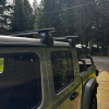 Black aluminum cross bars installed on Jeep Gladiator canopy