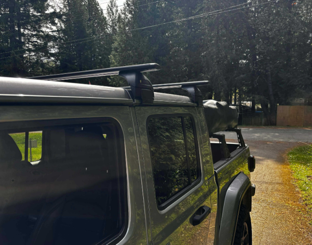 Black aluminum cross bars installed on Jeep Gladiator canopy