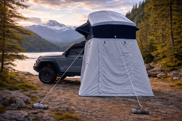 Jeep and rooftop tent by the lake